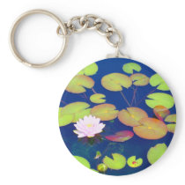 Pink Lotus Flower floating with lily pads on pond