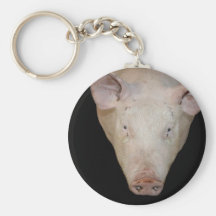 Pink pig head against black background key chain