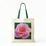 Pink rose in full bloom and meaning bags