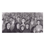 Praying by candle light in Lourdes, France photo cards