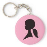 Profile of a woman with pony tail keychains