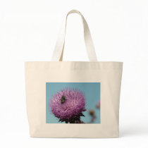 purple thistle with bee bags