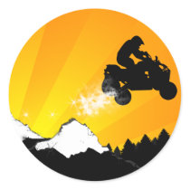 quads. orange sunset. round sticker