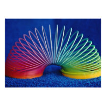 Rainbow-coloured slinky toy invites