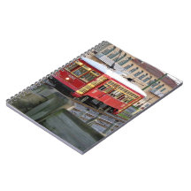 Red electric streetcar on tracks note book