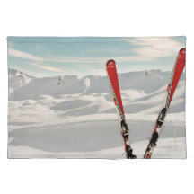 Red pair of ski standing in snow placemat