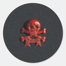 Red scull and cross bones round sticker