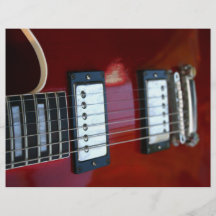 Red semi hollow guitar picture of strings, pickups flyer