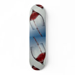 Red wine poured into wine glass skate deck