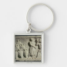Relief depicting a delivery of wine key chains