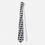 Ruffed grouse standing in snowy woods necktie