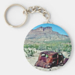 Rusted Antique Car In Front Of Butte Key Chains