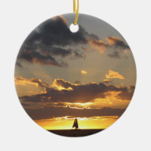 Sail boat at sunset ornaments