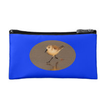 Sand piper running on a beach cosmetics bags