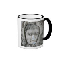 Sandstone head of Buddha surrounded by tree Mug