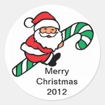 Santa Riding a Candy Cane Round Stickers
