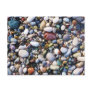 Sea pebbles and stones on a beach close up postcards
