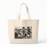 Seven rodeo cowgirls jokingly posing with a donkey bags