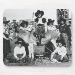 Seven rodeo cowgirls jokingly posing with a donkey mousepads