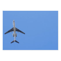 Single aeroplane on the blue sky background business cards