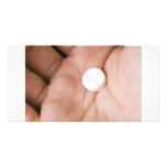 Single white pill in palm photo cards
