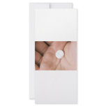 Single white pill in palm rack cards