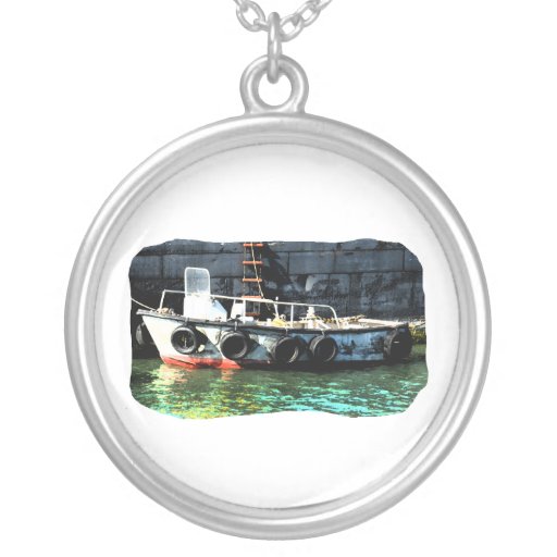 Small boat ladder tires in ocean by tug necklace