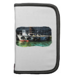 Small boat ladder tires in ocean by tug planner
