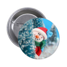 Snowman hiding or peeking from behind a tree pinback button