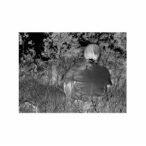 Solarised negative photograph of solo figure