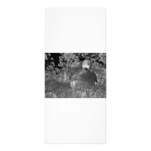 Solarised negative photograph of solo figure rack cards