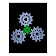 Some silver gears with a little green postcards