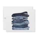 Stack of blue jeans invitations