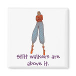 Stilt walkers are above it. fridge magnet