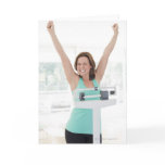 Successful weight loss. Happy woman weighing Greeting Cards