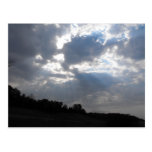 Sunrays breaking through postcard
