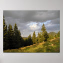 Sunset over cloudy mountains posters