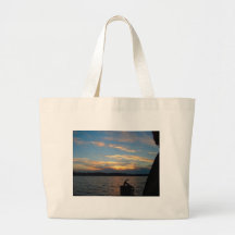 Sunset over River Canvas Bags