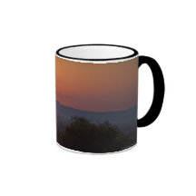 Sunset Over The African Landscape Mugs