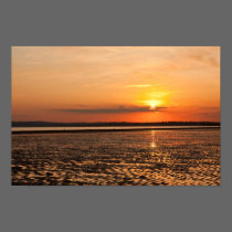 Sunset over the beach posters