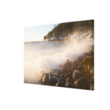Surf washes over the cobblestones in Monument Canvas Print