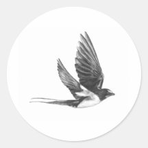 Swallow in flight round sticker