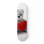 Teddy Bear Toy Holding A Heart On White Background skateboards