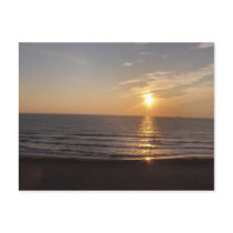 The beach at sunset postcard