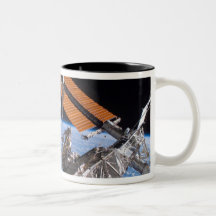 The Canadarm2 and solar array panel wings Mug
