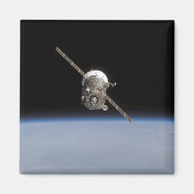 The Soyuz TMA-11 spacecraft above Earth's horiz Refrigerator Magnets