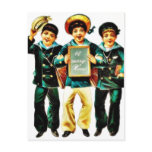 Three boys and one boys holds the christmas wishes postcard