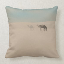 Three dromedary camels walking in Sahara desert Throw Pillows