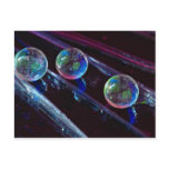 Three glass marbles rolling on smooth surface postcards