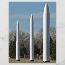 Three rocket models in show flyer design